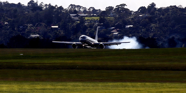 An RNZAF 757 aircraft makes an emergancy landing at RNZAF Base Auckland in Whenuapai. Photo / Dean Purcell