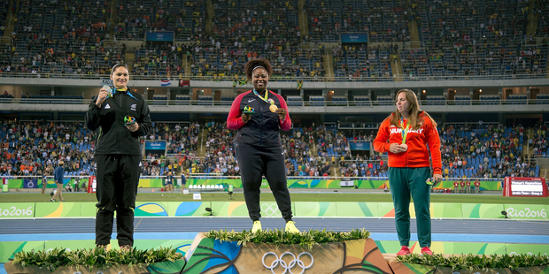 New Zealand's Valerie Adams (L) Silver, Michelle Carter of the USA Gold (C and Anita Marton of Hungry Bronze during a medal ceremony for the Women's Shot Put. Photo / AP.