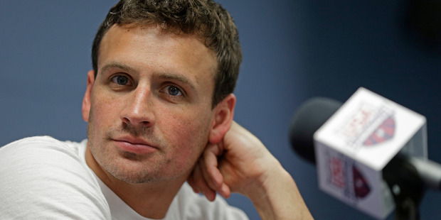 Ryan Lochte has apologised for his role in the robbery scandal that enveloped US swimming. Photo / AP