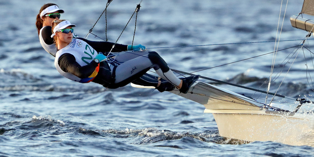 New Zealand's Alex Maloney, back, and teammate Molly Meech won silver in the 49erFX class. Photo / AP