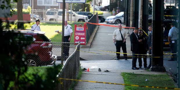 Sandals lay on a street corner at the crime scene not far from the Al-Furqan Jame Masjid Mosque in the Ozone Park neighborhood of Queens, New York. Photo / AP