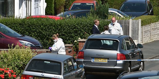 British forensic officers attend the scene where former Aston Villa soccer player Dalian Atkinson died after he was tasered by police. Photo / AP