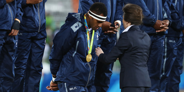 CHAMPIONS: The Fiji Sevens team were gracious in accepting their gold medals from HRH Princess Anne. PHOTO / GETTY