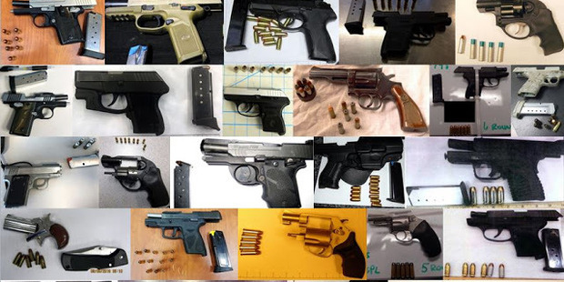 A TSA composite photo offers a look at some of the 78 firearms airport security officials said they captured in just one week at airports nationwide. Photo / TSA handout photo