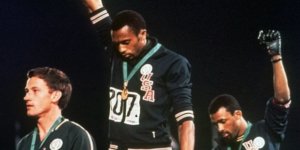 Tommie Smith, centre and John Carlos, right, at the Mexico Olympics 1968. Australian silver medallist Peter Norman is at left. Photo / AP