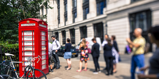 Customers line up at the Spier Salads, a converted red telephone box, in London. Photo / Bloomberg