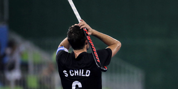 New Zealand's Simon Child, reacts after his team lost against Germany 3-2 during a men's field hockey quarterfinal. Photo / AP