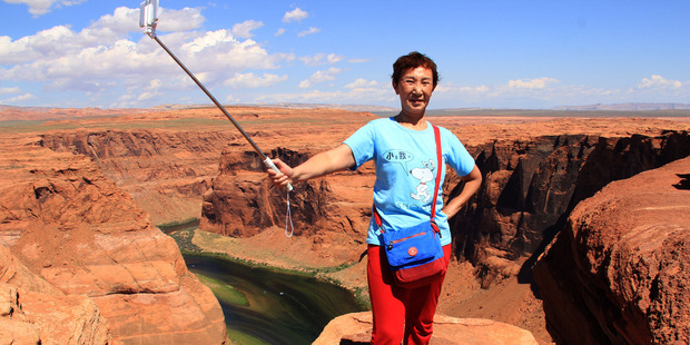 Chen Aiwu, 64, at Horseshoe Bend in Colorado in June. Photo / Supplied