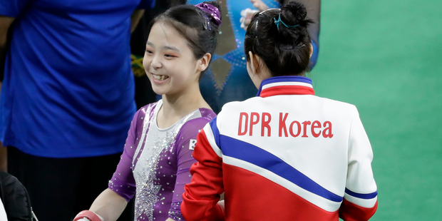 South Korea's Lee Eun-ju, left, smiles as she talks with North Korea's Hong Un Jong. Photo / AP