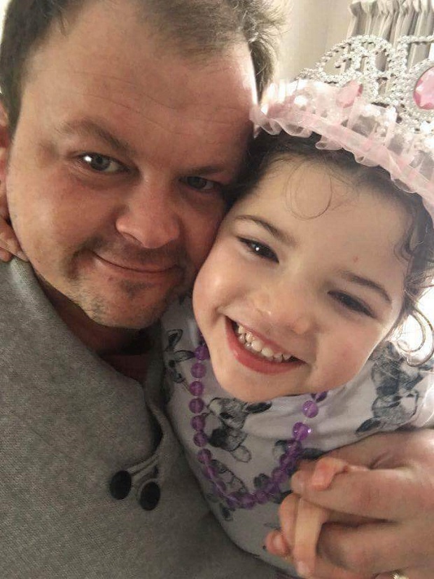 Mia with her dad.