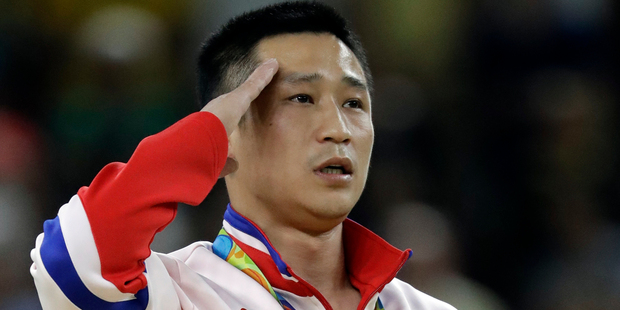 Viewers pointed out that the athlete looked miserable, despite being only the third gymnast ever to take gold for his country. Photo / AP