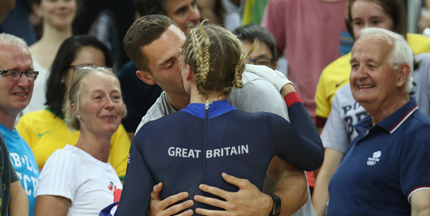 Rebecca James of Great Britain celebrates winning the silver medal with a kiss from Welsh rugby winger George North. Photo / Getty