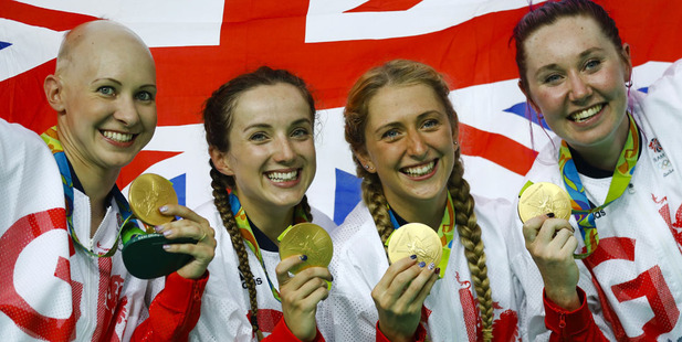 Britain's team, from left, Joanna Rowsell Shand, Elinor Barker, Laura Trott and Katie Archibald pose with their gold medals. Photo / AP