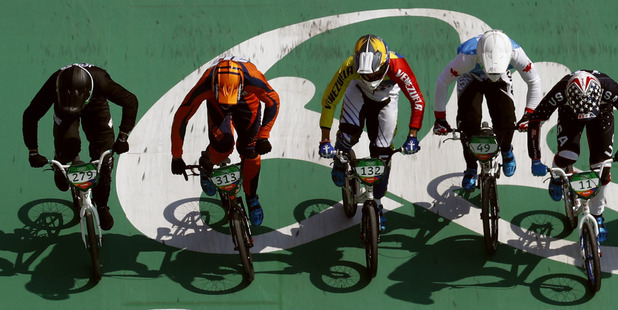 Kiwi cyclist Trent Jones, left, competes in the men's BMX semifinals. Photo / AP