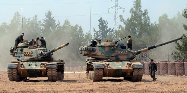Turkish soldiers wait near the border with Syria, where Turkish troops have helped take the town of Jarabulus. Photo / AP
