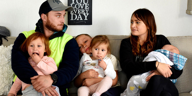 Papamoa house fire survivors Kent Robinson, and his partner Savanna Wichman and their children Tayla-Rose, 3, Riley, 6, Winter, 2, and 4-month-old Alistair. Photo/George Novak