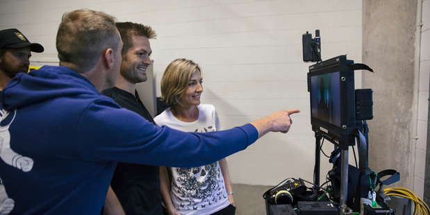 Justin Pemberton and Michelle Walsh in action with Richie McCaw.