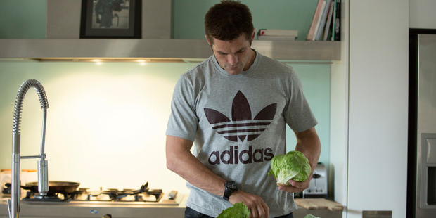 Richie McCaw cooks up a cajun chicken salad in his Christchurch home in a scene from Chasing Great.