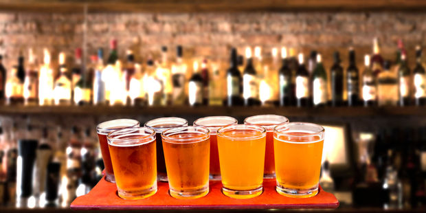 Trying local craft beers is a great travel perk. Photo / 123RF