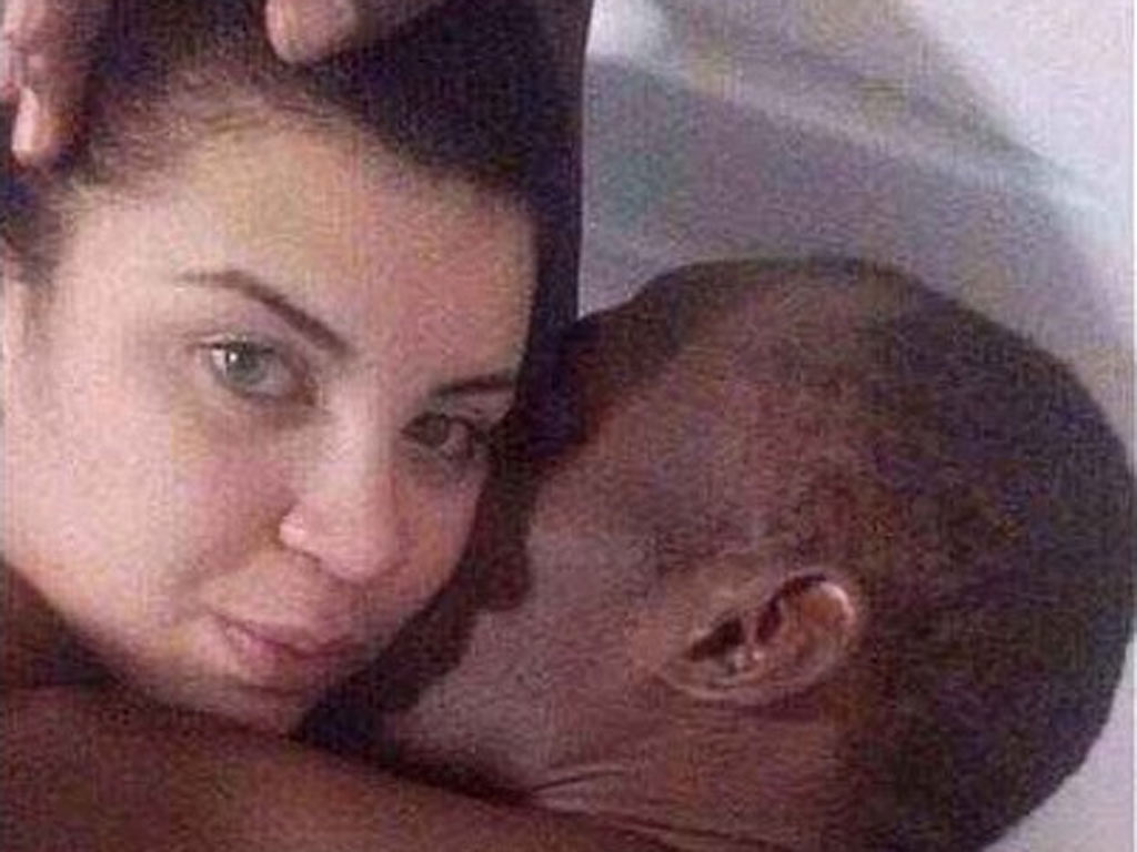 In one of the photos (pictured) Bolt seems to give Duarte, 20, a kiss on the cheek while she looks into the camera.