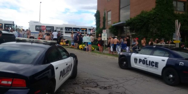 Revellers line up to get on buses back home. Photo / Twitter, Samia Police