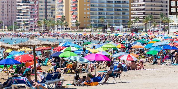 Tourists are reportedly getting in early to reserve spots on Spain's beaches and then disappearing for hours, leaving little space for other beach goers. Photo / Getty Images