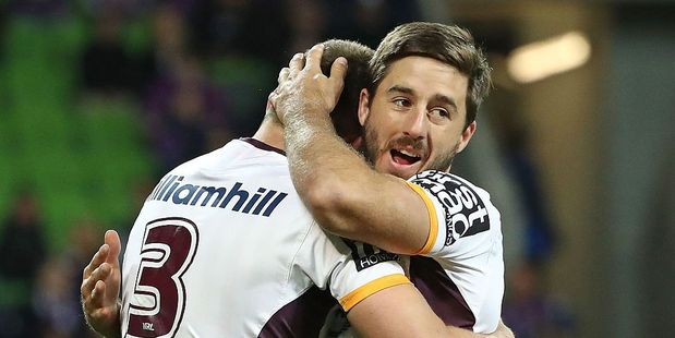 Tom Opacic of the Broncos is congratulated by Ben Hunt after scoring a try against the Melbourne Storm. Photo / Getty Images