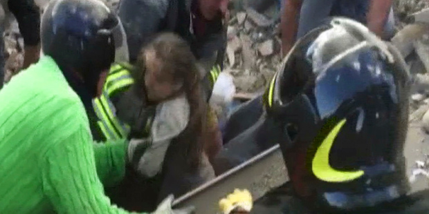 The 10-year-old girl was pulled alive from the rubble 17 hours after the quake. Photo / AP