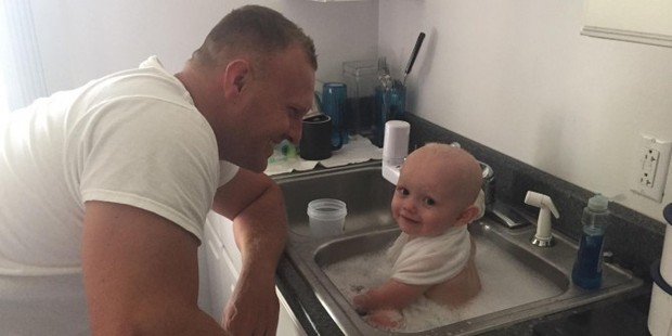 Senior Trooper D.C. Graham gave the baby a bath in the sink and then held him until CPS picked him up. Photo / West Virginia State Police Princeton Detachment