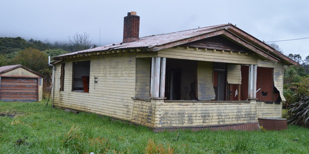 The house in Runanga without its windows. Photo / Greymouth Star