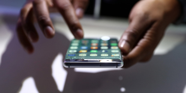 Either a new wired set will connect to the phone's existing Lightning port, currently used to dock and charge the phone, or wireless, Bluetooth-powered earpieces will be offered to customers.