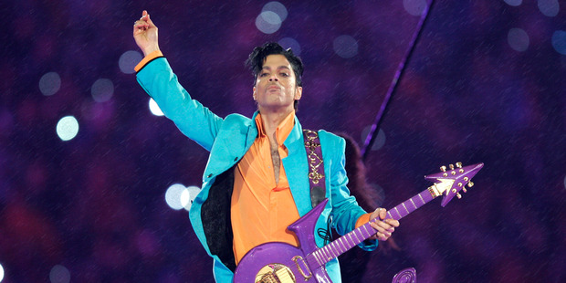 Prince performing with his signature guitar. Photo / AP