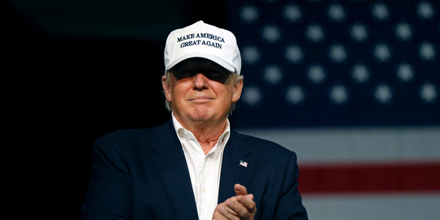 Donald Trump arrives onstage to speak at a rally in Dimondale. Photo / AP