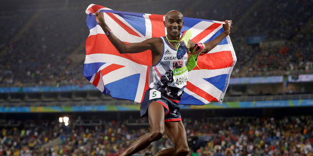 Britain's Mo Farah celebrates winning the gold medal in the men's 5000-metre final. Photo / AP