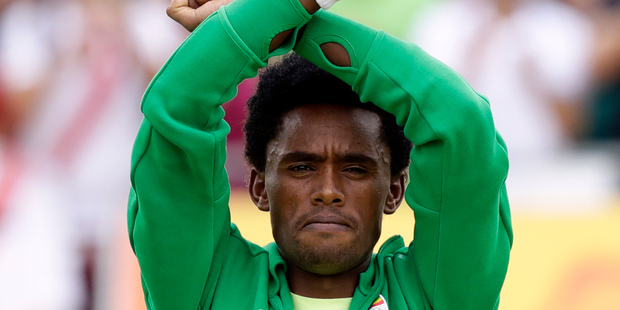Feyisa Lilesa crossed his arms above his head in an "X" as he finished the gruelling event as a protest against the Ethiopian government's crackdown on political dissent. Photo / AP