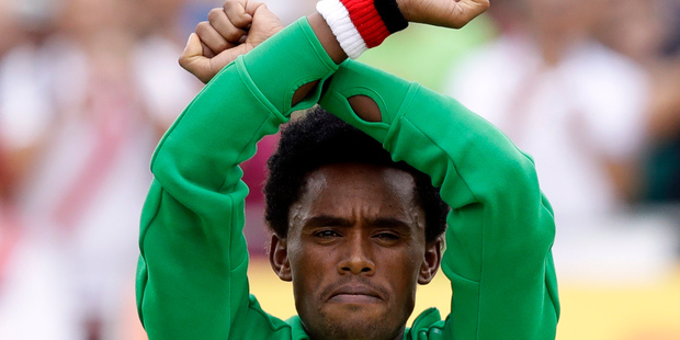 Feyisa Lilesa, who crossed his wrists in protest of the Ethiopian government, said he feared being killed or imprisoned if he ever returned to the East African country. Photo / AP