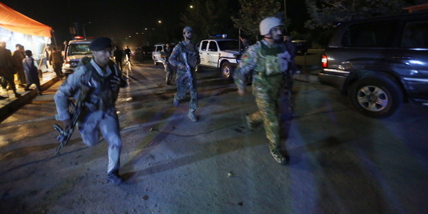Afghan security forces rush to respond to a complex Taliban attack on the campus of the American University in the Afghan capital Kabul. Photo / AP
