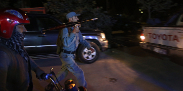 Afghan security forces rush to respond to the attack. Photo / AP