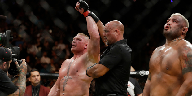 Brock Lesnar celebrates after defeating Mark Hunt during their heavyweight mixed martial arts bout at UFC 200. Photo / AP
