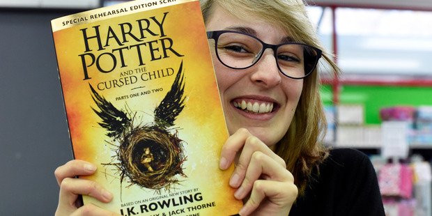 Harry Potter fan Stevie Price with a copy of Harry Potter and the Cursed Child. Photo / George Novak