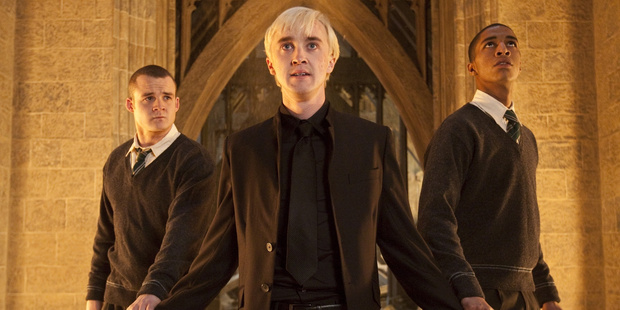 Tom Felton as Draco Malfoy, Josh Herdman as Gregory Goyle and Louis Cordice as Blaise Zabini enter the Room of Requirement.