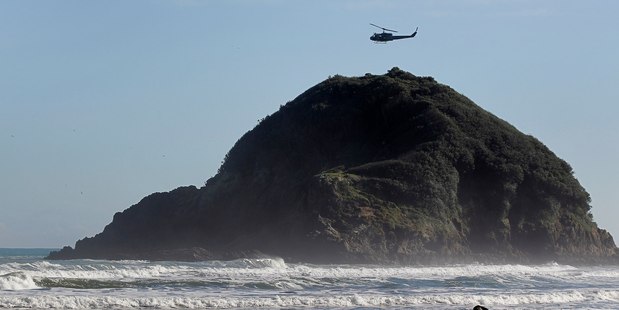 The search for a teenager who went missing when his boat capsized near Paritutu rock in Taranaki is now a recovery operation. Photo/ file.