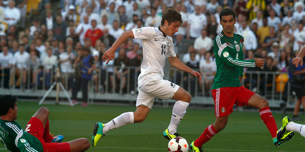All Whites midfielder Marco Rojas, in action against Mexico in 2013, is returning to the A-League. Photo / NZ Herald.