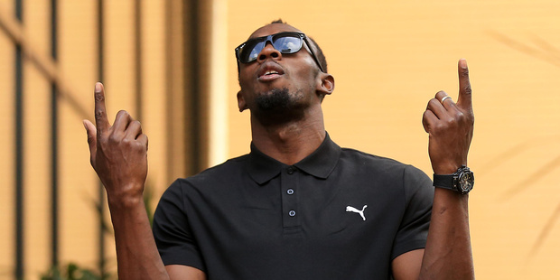 Usain Bolt of Jamaica arrives for a press conference. Photo / AP