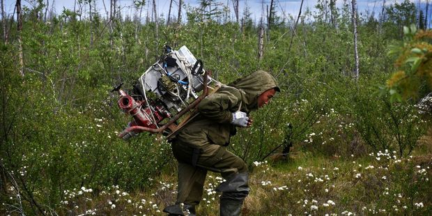 To keep his expedition cheap, this young tusker converted the engine from a Soviet-era Buran snowmobile into a water pump. Photo / Amos Chapple/RFE/RL