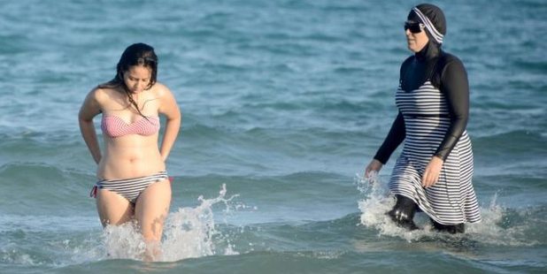 A woman wears a burkini-style swimsuit on a beach in Marseille, southern France. Photo / AP