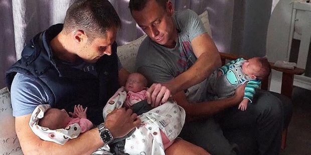 Theo and Christo Menelaou cuddle their new babies. Photo / Sky News