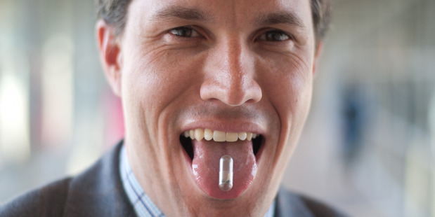 Dr Christopher Bettinger of Carnegie Mellon University demonstrates the edible battery he and his colleagues have created. Photo / Bettinger lab