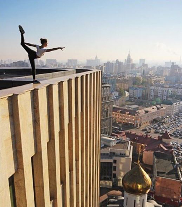 She is often found performing vertigo-inducing gymnastic stunts just inches from the edge of roofs, seen here in Moscow. Photo / Angela Nikolau Instagram