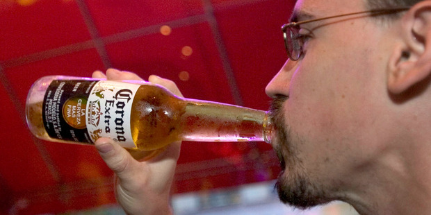 A patron drinks a Corona in Mo's Carribbean resturant in New York. Photo / Daniel Acker